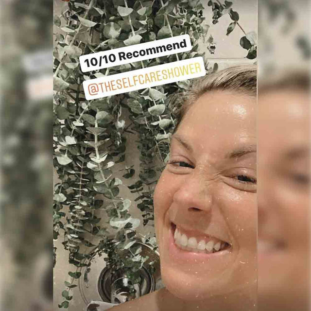 Lady smiling in shower with fresh eucalyptus in the background. The text says 10 out of 10 recommend self care shower